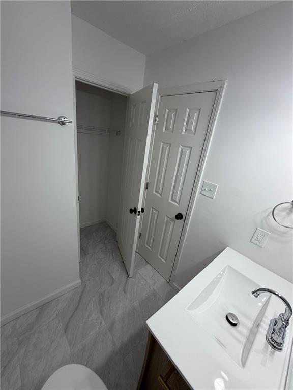 2250 Kings Gate Circle Southwest, Unit B Snellville, GA 30078 - Photo 26 of 31 a bathroom with a sink and mirror