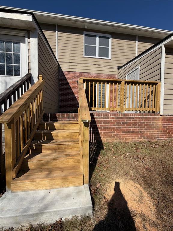 2250 Kings Gate Circle Southwest, Unit B Snellville, GA 30078 - Photo 31 of 31 a view of entryway with wooden floor