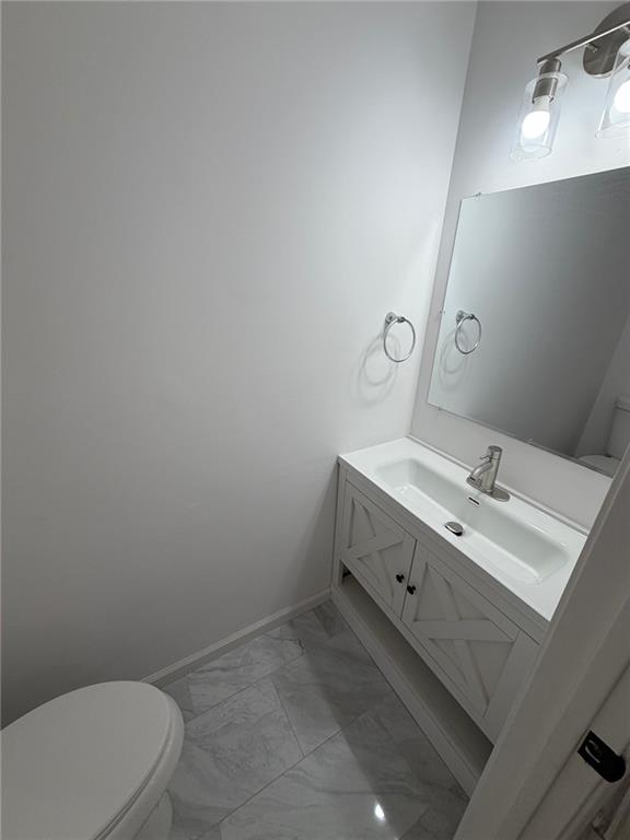 2250 Kings Gate Circle Southwest, Unit B Snellville, GA 30078 - Photo 10 of 31 a bathroom with a sink mirror vanity and toilet