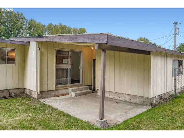 a view of a house with small yard