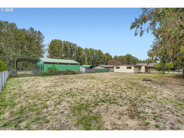 a backyard of a house with lots of green space