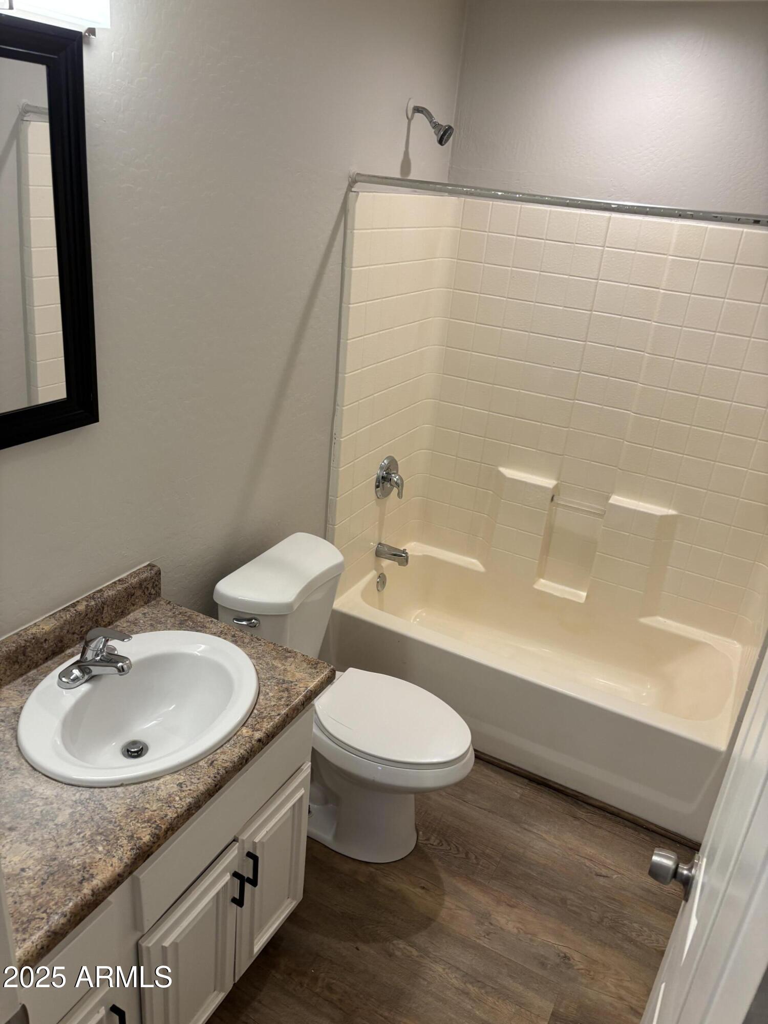 528 East Navajo Avenue, Unit 3 Apache Junction, AZ 85119 - Photo 5 of 14 a bathroom with a sink a toilet and shower