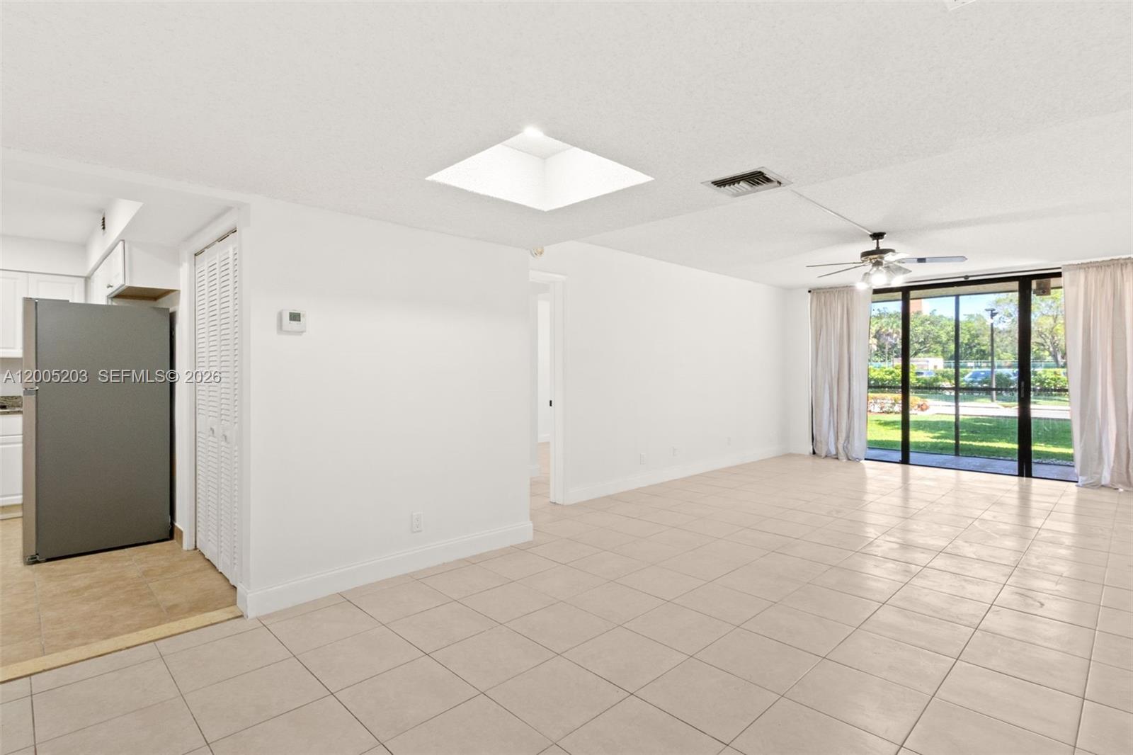 16400 Golf Club Road, Unit 104 Weston, FL 33326 - Photo 13 of 34 a view of an empty room with a window