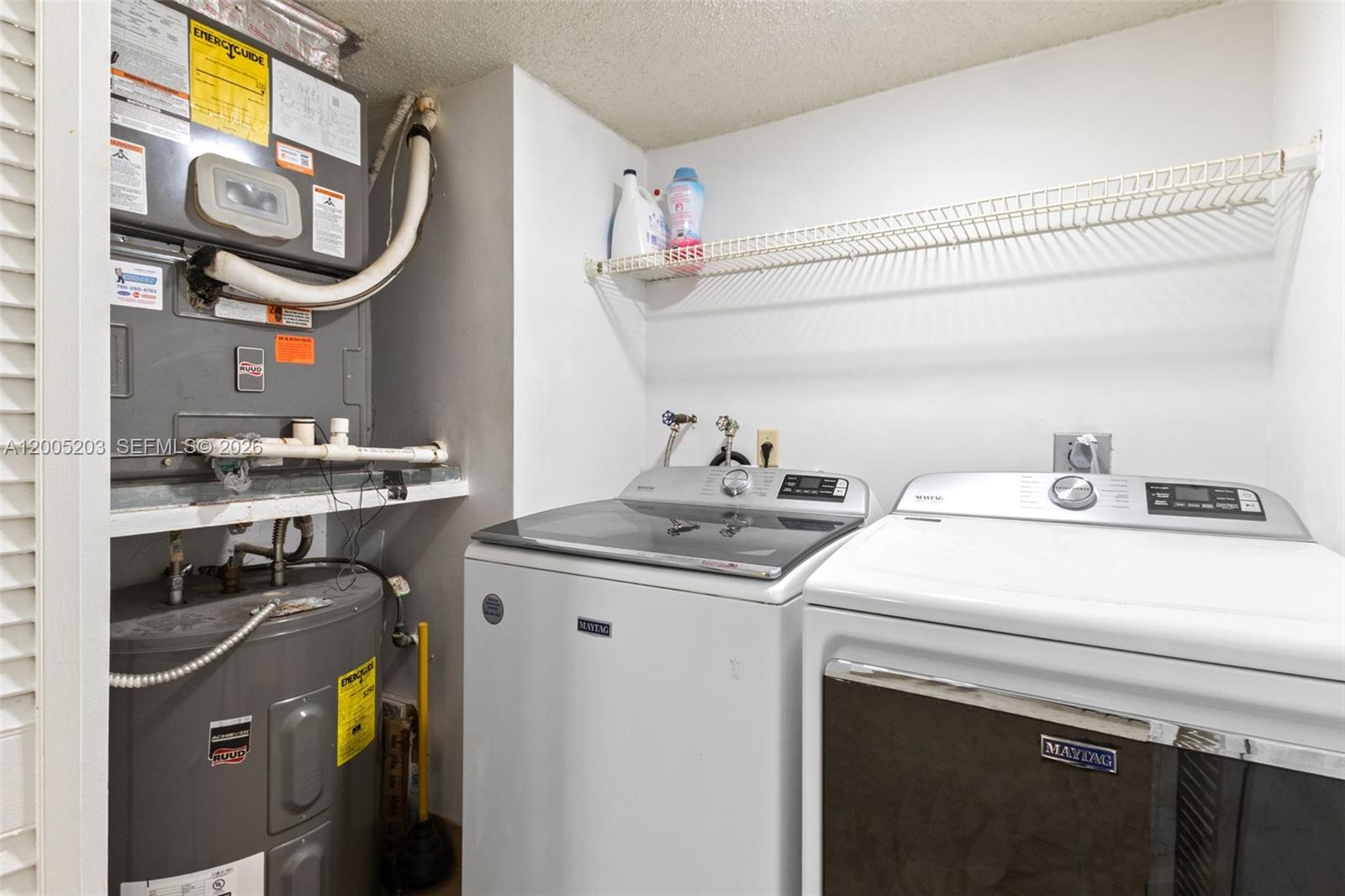 16400 Golf Club Road, Unit 104 Weston, FL 33326 - Photo 18 of 34 a utility room with dryer and washer