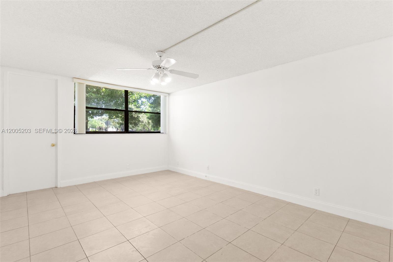 16400 Golf Club Road, Unit 104 Weston, FL 33326 - Photo 20 of 34 an empty room with a window