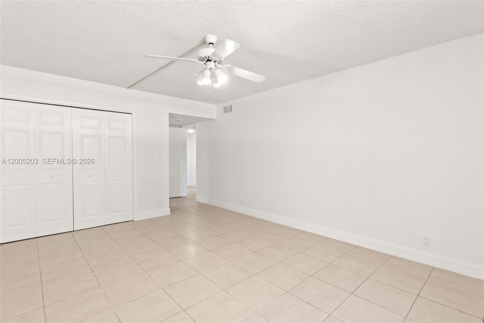 16400 Golf Club Road, Unit 104 Weston, FL 33326 - Photo 22 of 34 wooden floor in an empty room