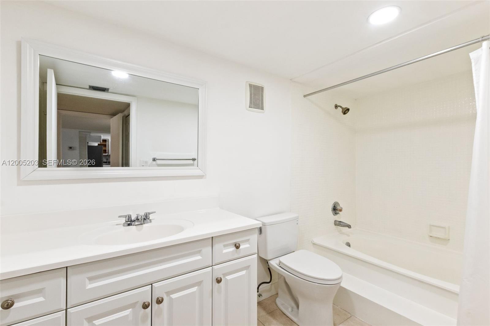 16400 Golf Club Road, Unit 104 Weston, FL 33326 - Photo 25 of 34 a bathroom with a sink a toilet and shower