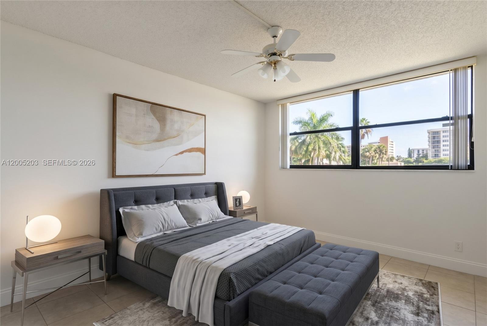 16400 Golf Club Road, Unit 104 Weston, FL 33326 - Photo 28 of 34 a bedroom with a bed and a painting on the wall