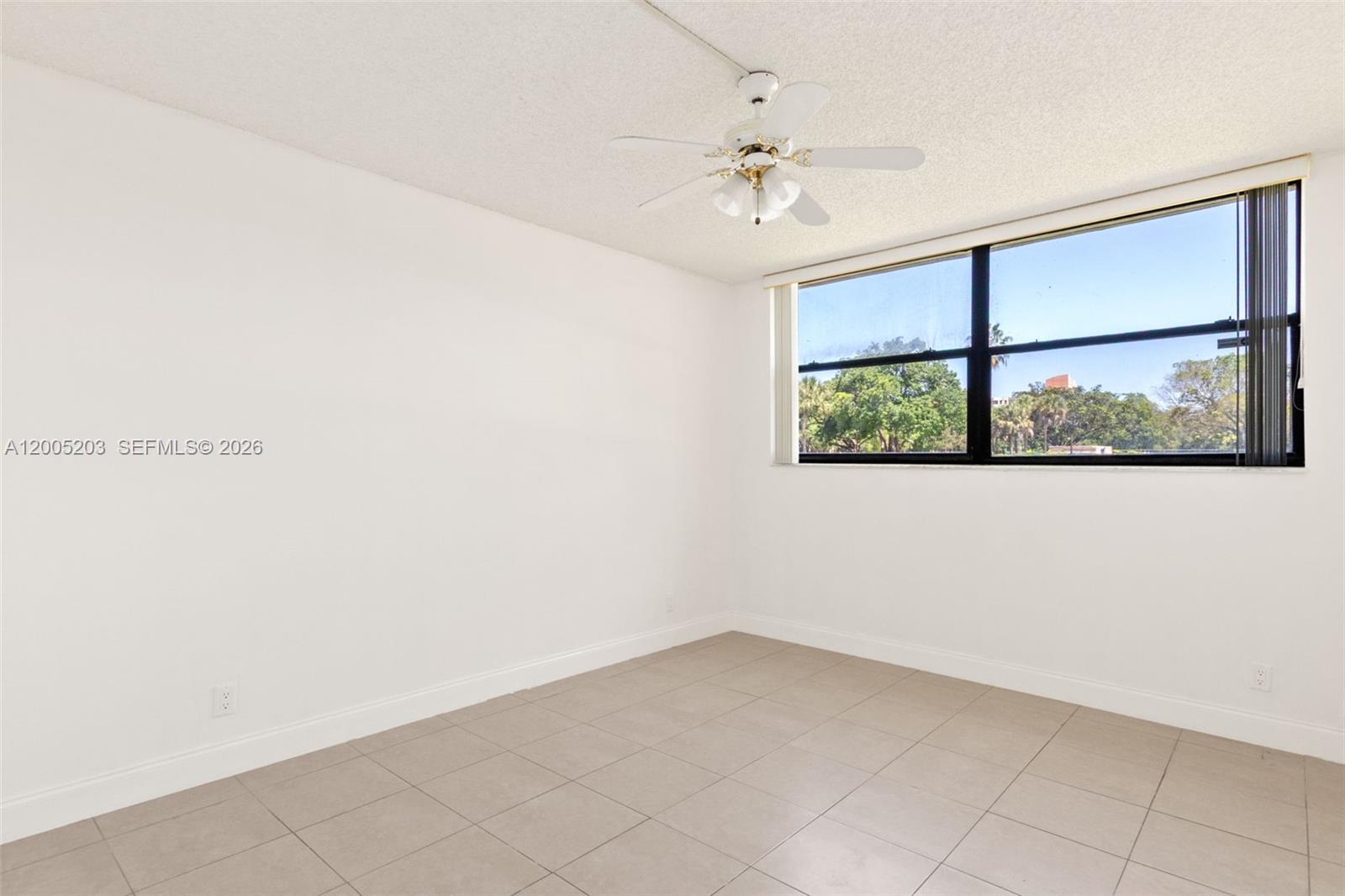 16400 Golf Club Road, Unit 104 Weston, FL 33326 - Photo 29 of 34 an empty room with a window