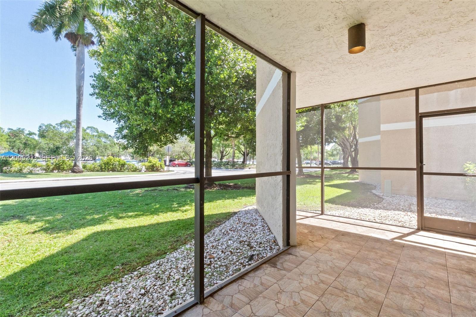 16400 Golf Club Road, Unit 104 Weston, FL 33326 - Photo 31 of 34 a view of outdoor space and deck