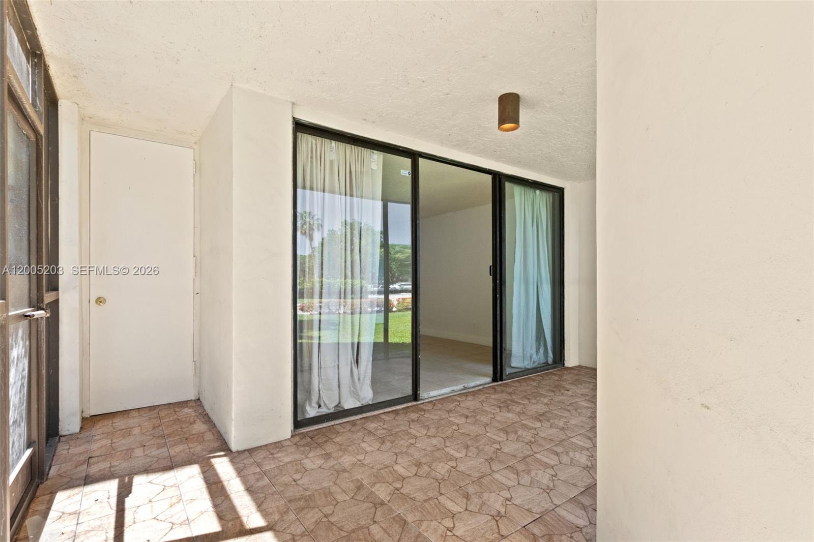 16400 Golf Club Road, Unit 104 Weston, FL 33326 - Photo 32 of 34 a view of hallway with window