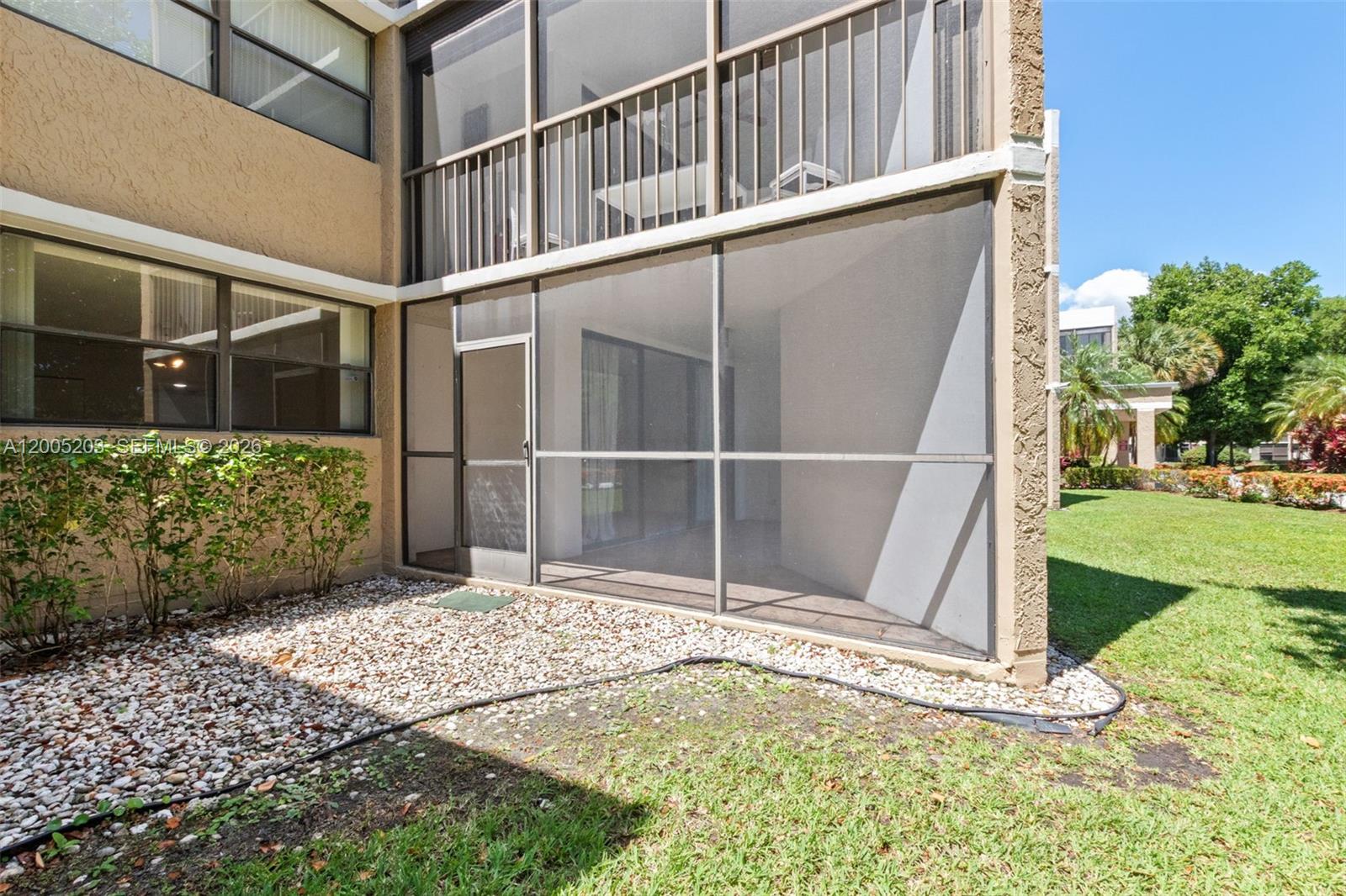 16400 Golf Club Road, Unit 104 Weston, FL 33326 - Photo 34 of 34 a view of a backyard