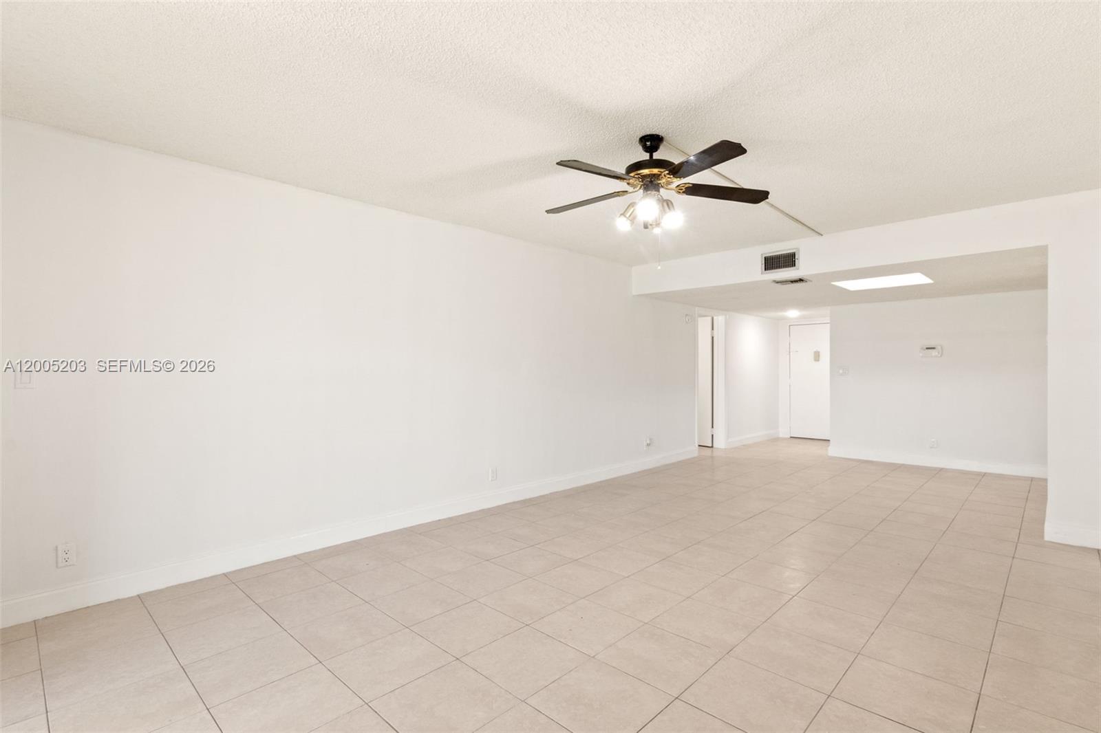 16400 Golf Club Road, Unit 104 Weston, FL 33326 - Photo 8 of 34 wooden floor in an empty room