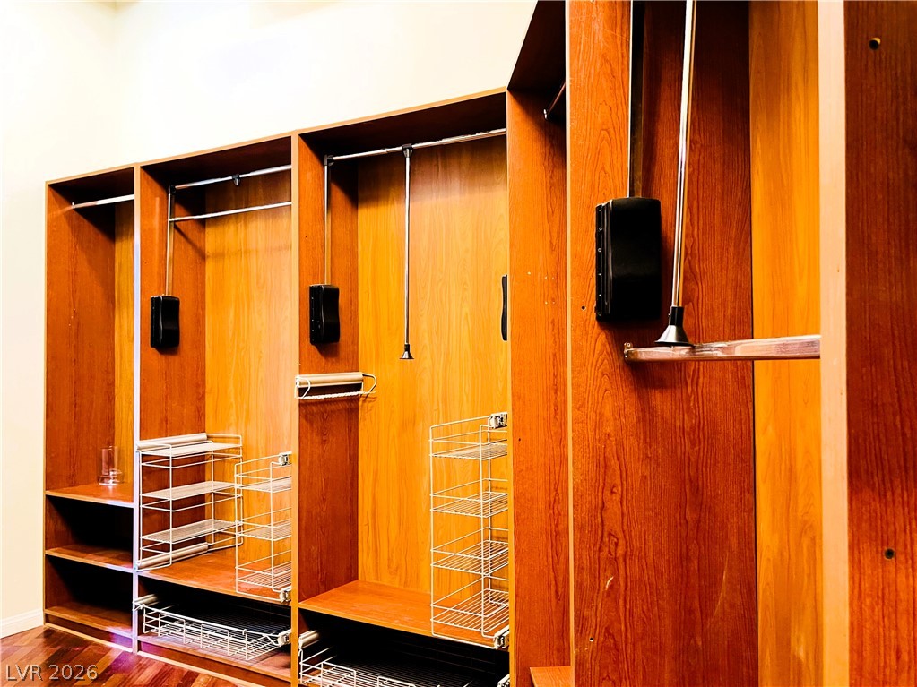 360 East Desert Inn Road, Unit 507 Las Vegas, NV 89109 - Photo 17 of 37 Rich wood built-ins and custom storage systems offer exceptional organization.