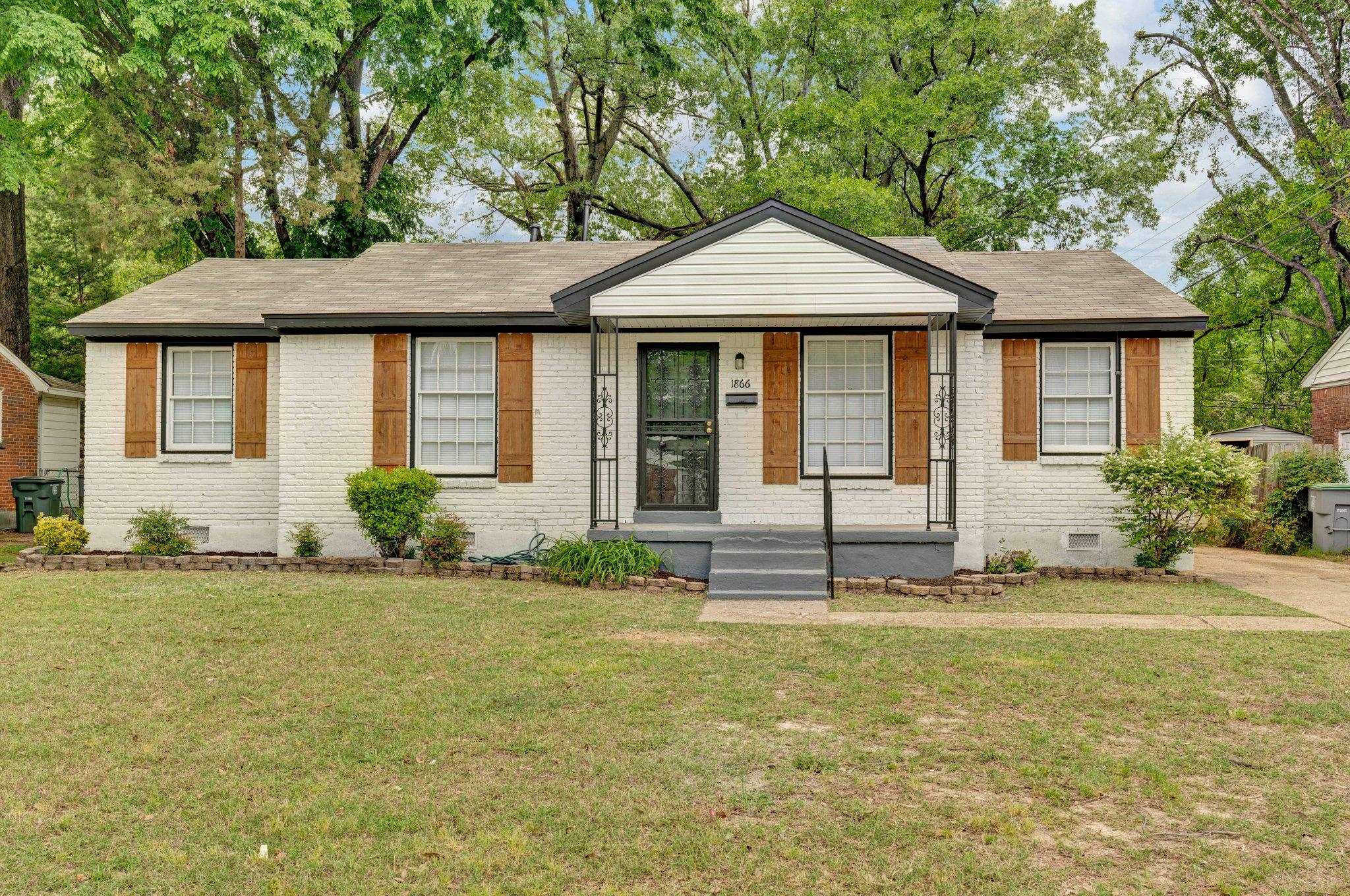 1866 Cherry Road Memphis, TN 38117 - Photo 1 of 20 a front view of a house with a yard