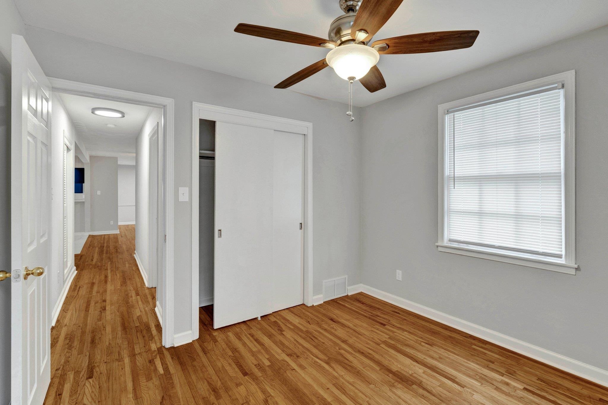 1866 Cherry Road Memphis, TN 38117 - Photo 11 of 20 wooden floor in an empty room with a window