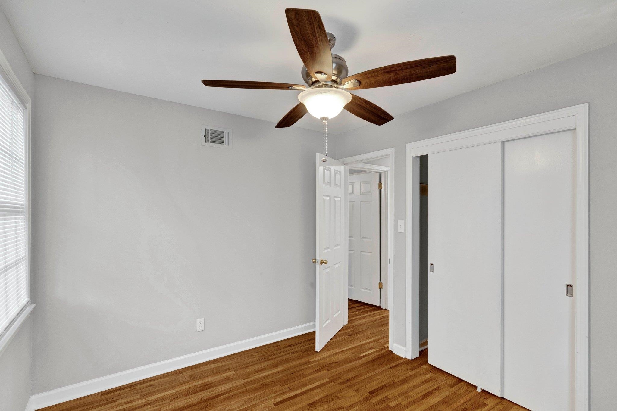 1866 Cherry Road Memphis, TN 38117 - Photo 12 of 20 a view of empty room with wooden floor