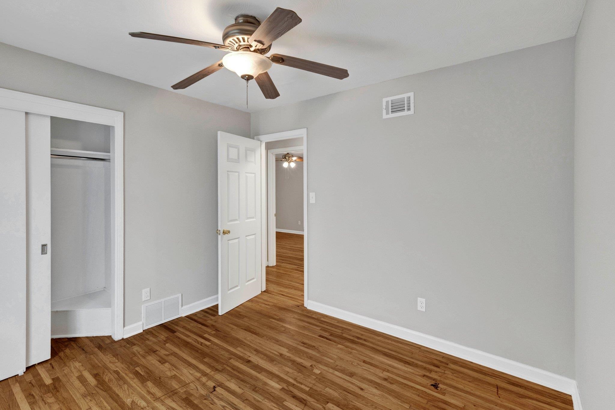 1866 Cherry Road Memphis, TN 38117 - Photo 14 of 20 a view of empty room with wooden floor