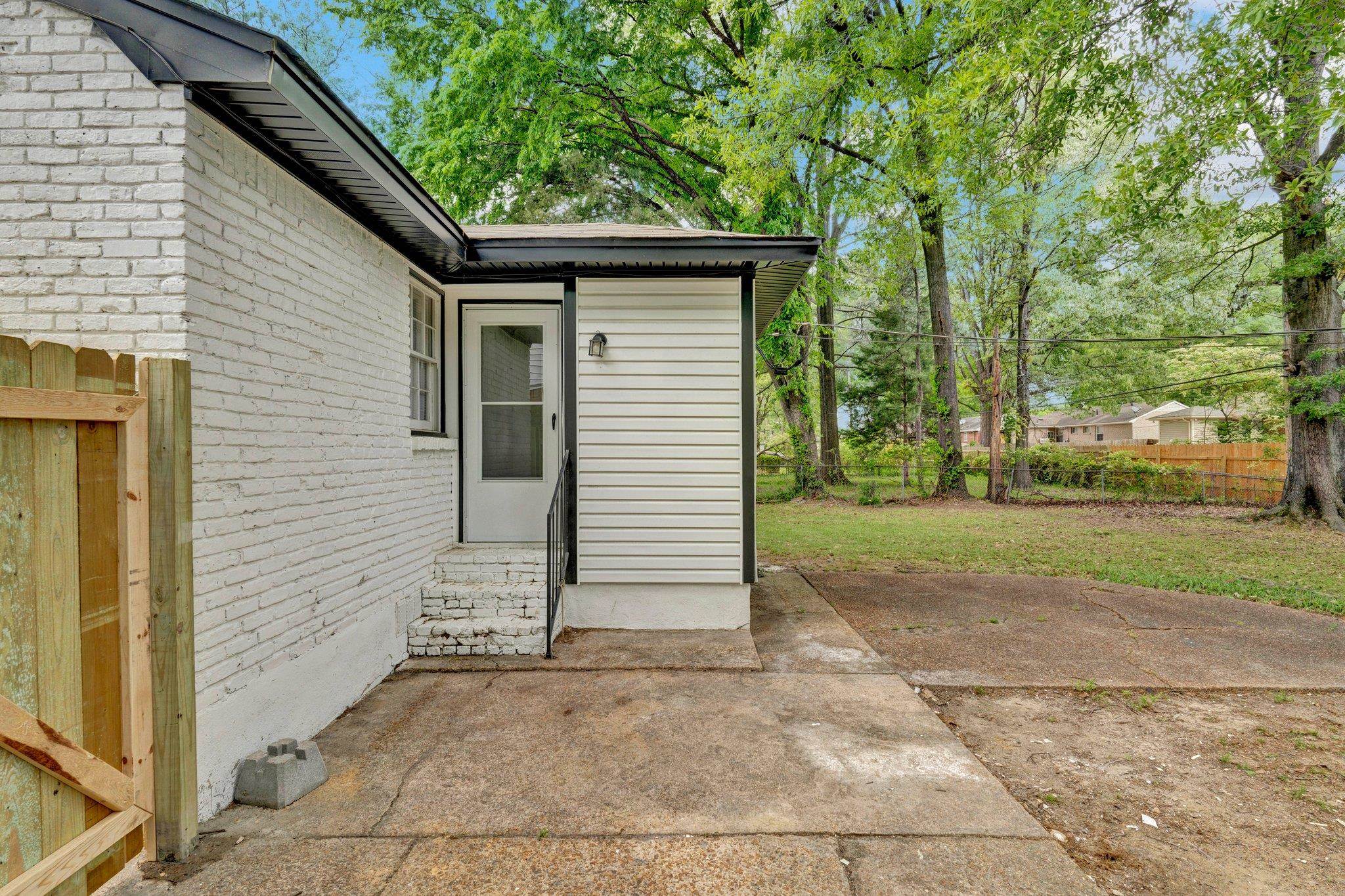 1866 Cherry Road Memphis, TN 38117 - Photo 17 of 20 a side view of a house with a yard