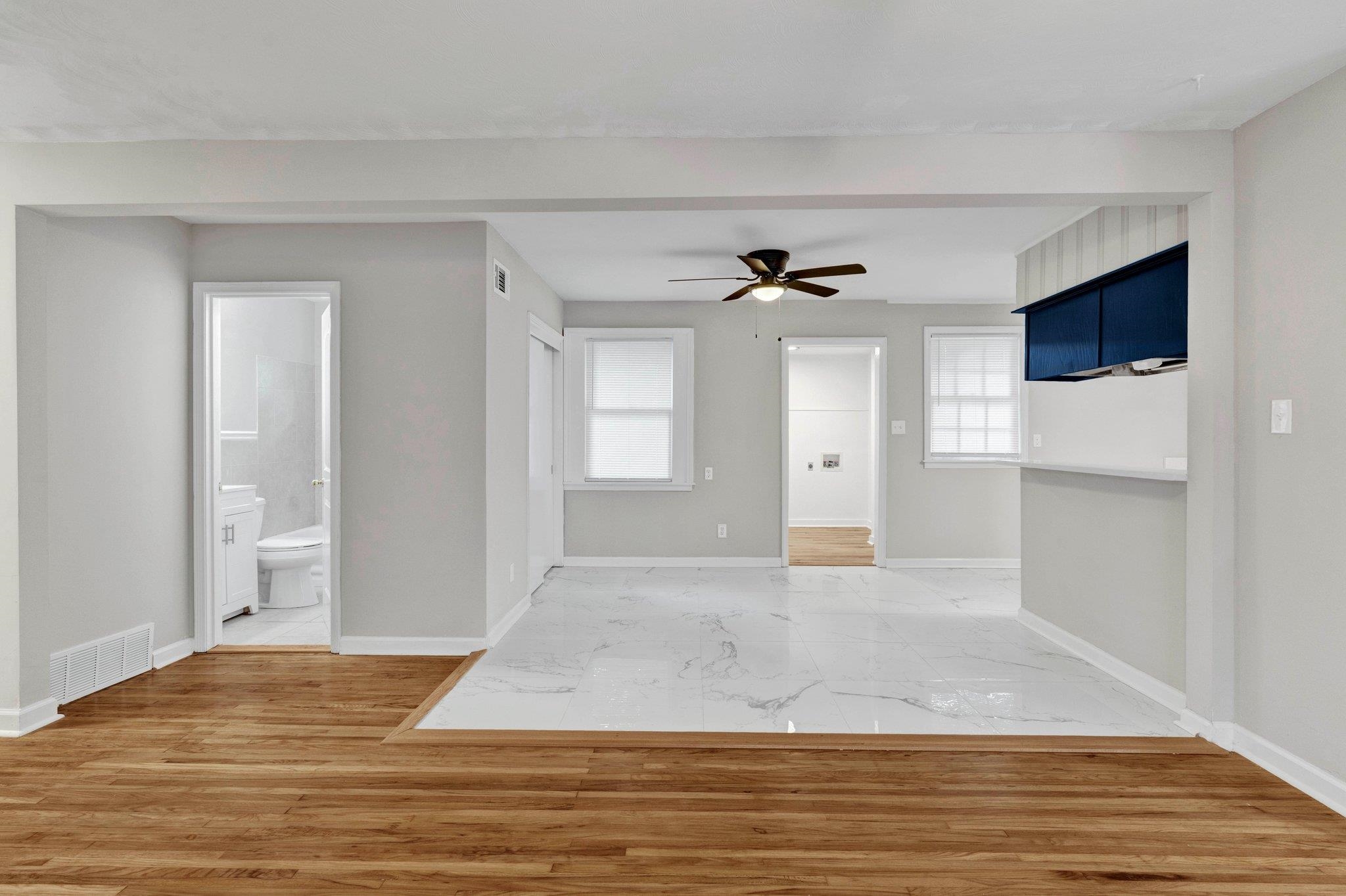 1866 Cherry Road Memphis, TN 38117 - Photo 3 of 20 a view of a livingroom with an empty space & wooden floor