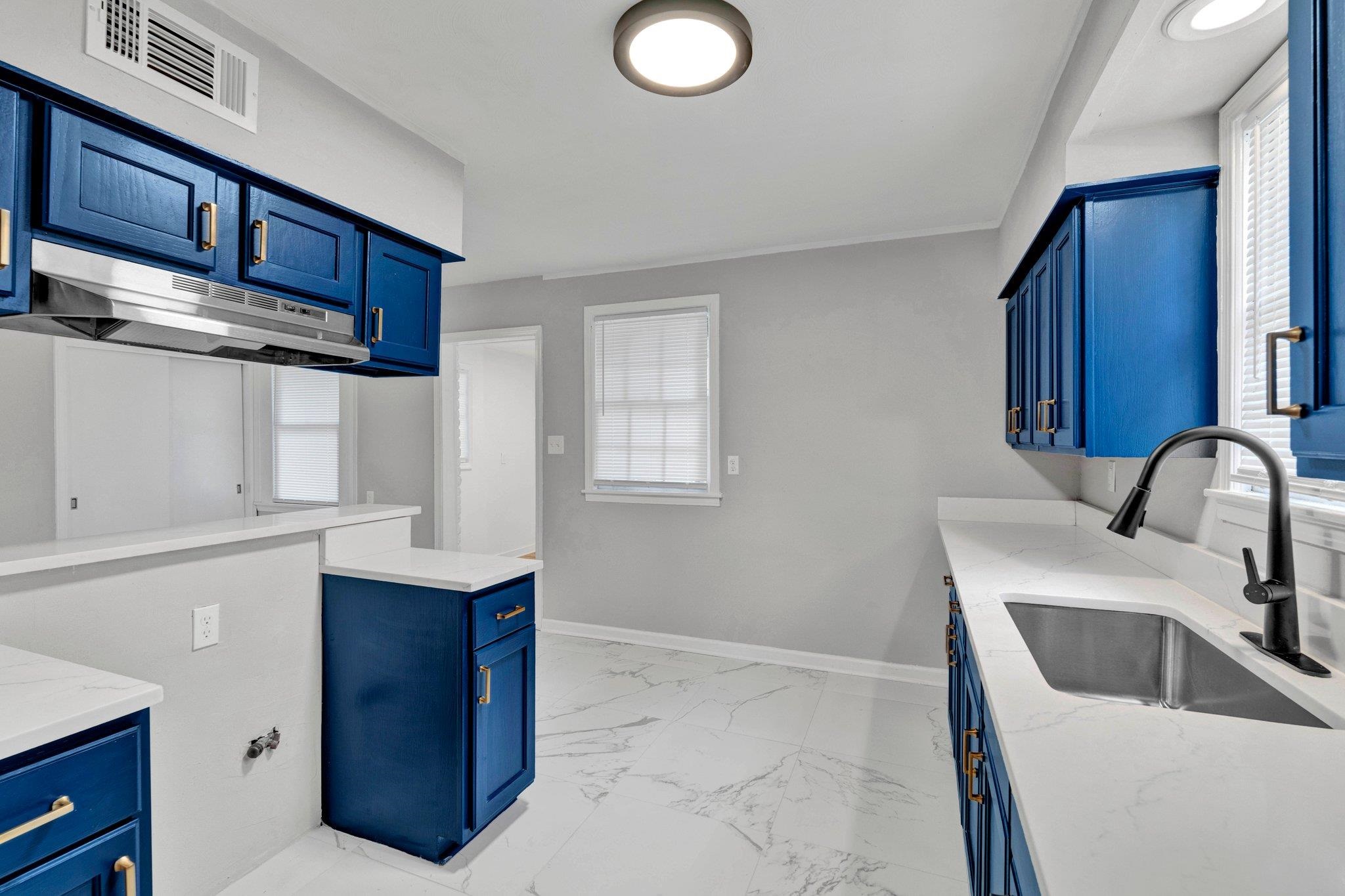 1866 Cherry Road Memphis, TN 38117 - Photo 8 of 20 a kitchen with stainless steel appliances granite countertop a sink stove and cabinets