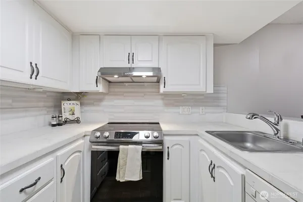 a kitchen with a sink and cabinets