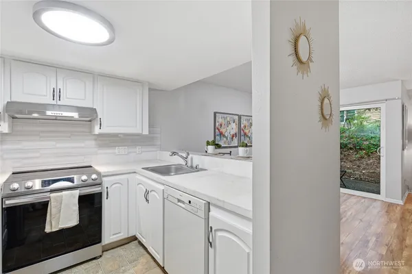a kitchen with a stove and a sink