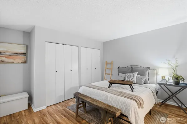 a bedroom with a bed and a couch