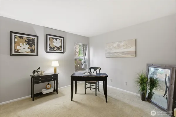 a room with furniture and potted plants