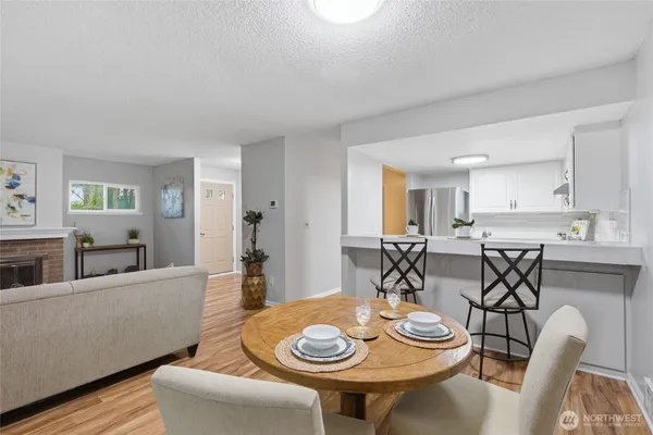 a view of a dining room with furniture and wooden floor