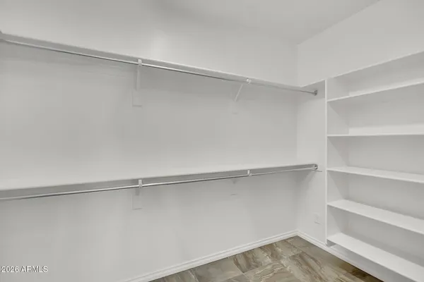 a view of an empty walk in closet