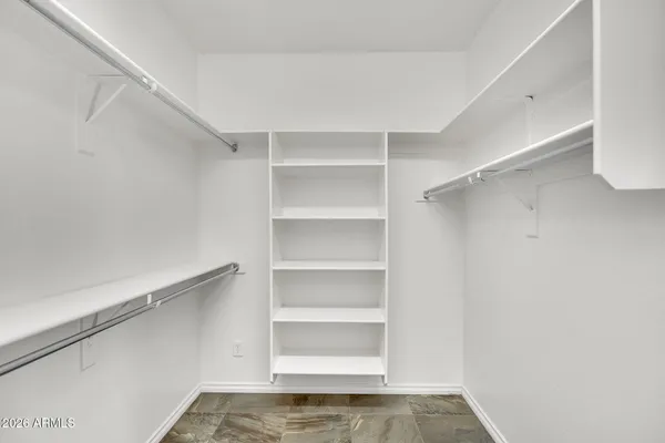 a view of an empty walk in closet