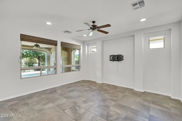 a view of an empty room with a window