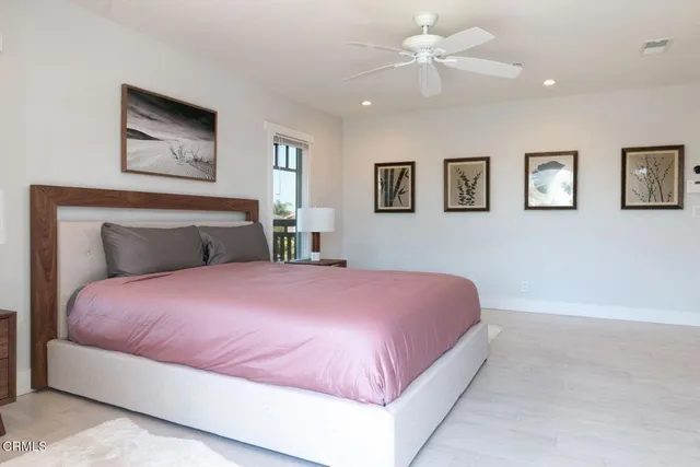 front view of a house with a flower garden