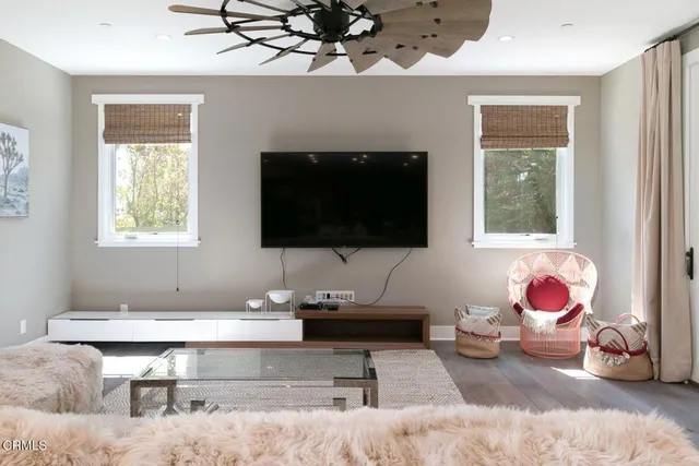 a view of a house with potted plants