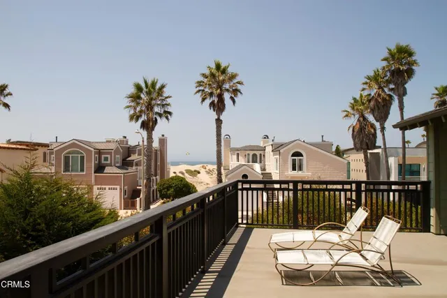 a view of a houses with a balcony