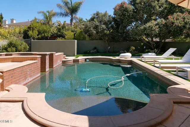 a bathroom with double vanity sink and two mirror