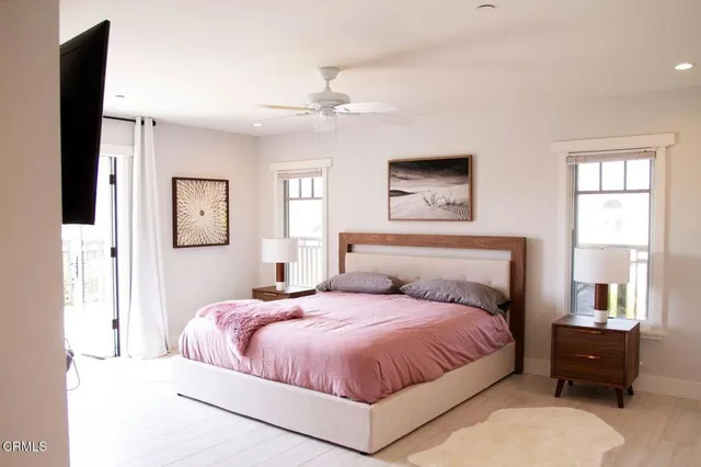 a bedroom with a large bed and a window