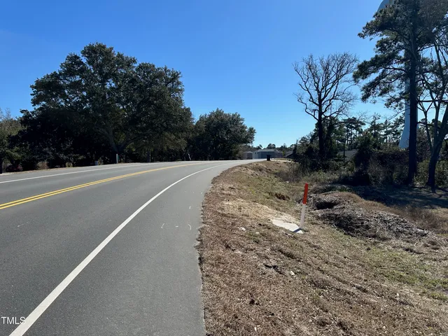 a view of a road with a yard