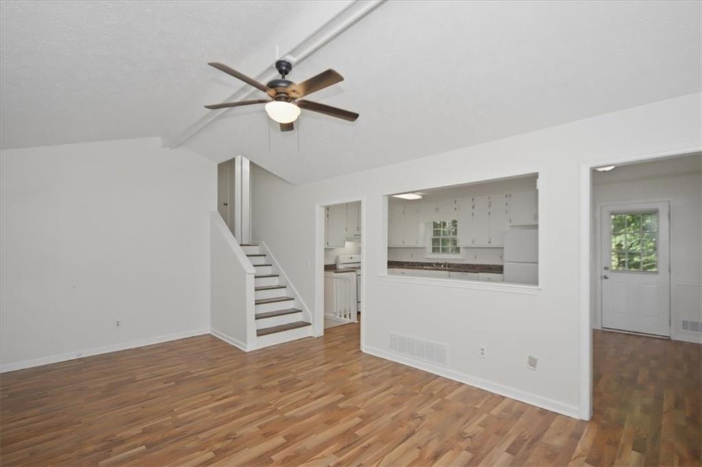 1496 Cherry Hill Road Southwest Conyers, GA 30094 - Photo 4 of 32 a view of a hardwood floor in a room with a window