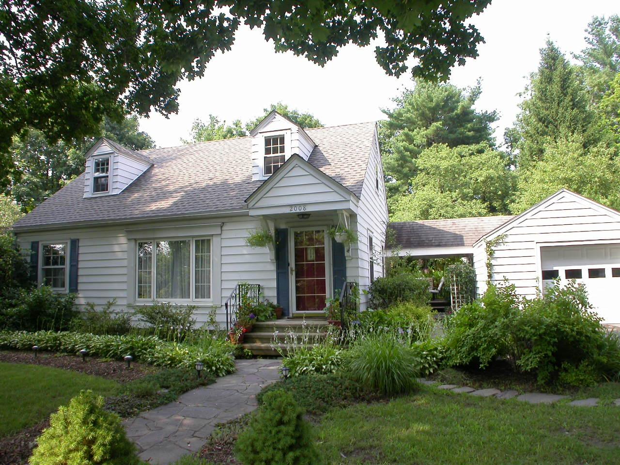 2008 Tanite Road Stroudsburg, PA 18360 - Photo 1 of 6 a front view of a house with a garden
