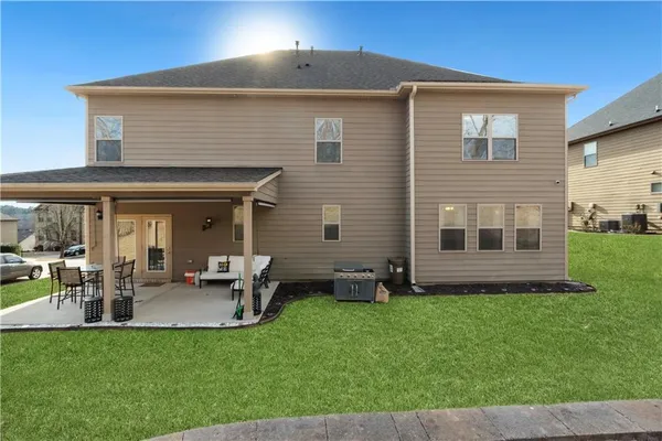 a front view of a house with a yard