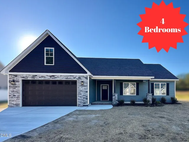 a front view of a house with yard