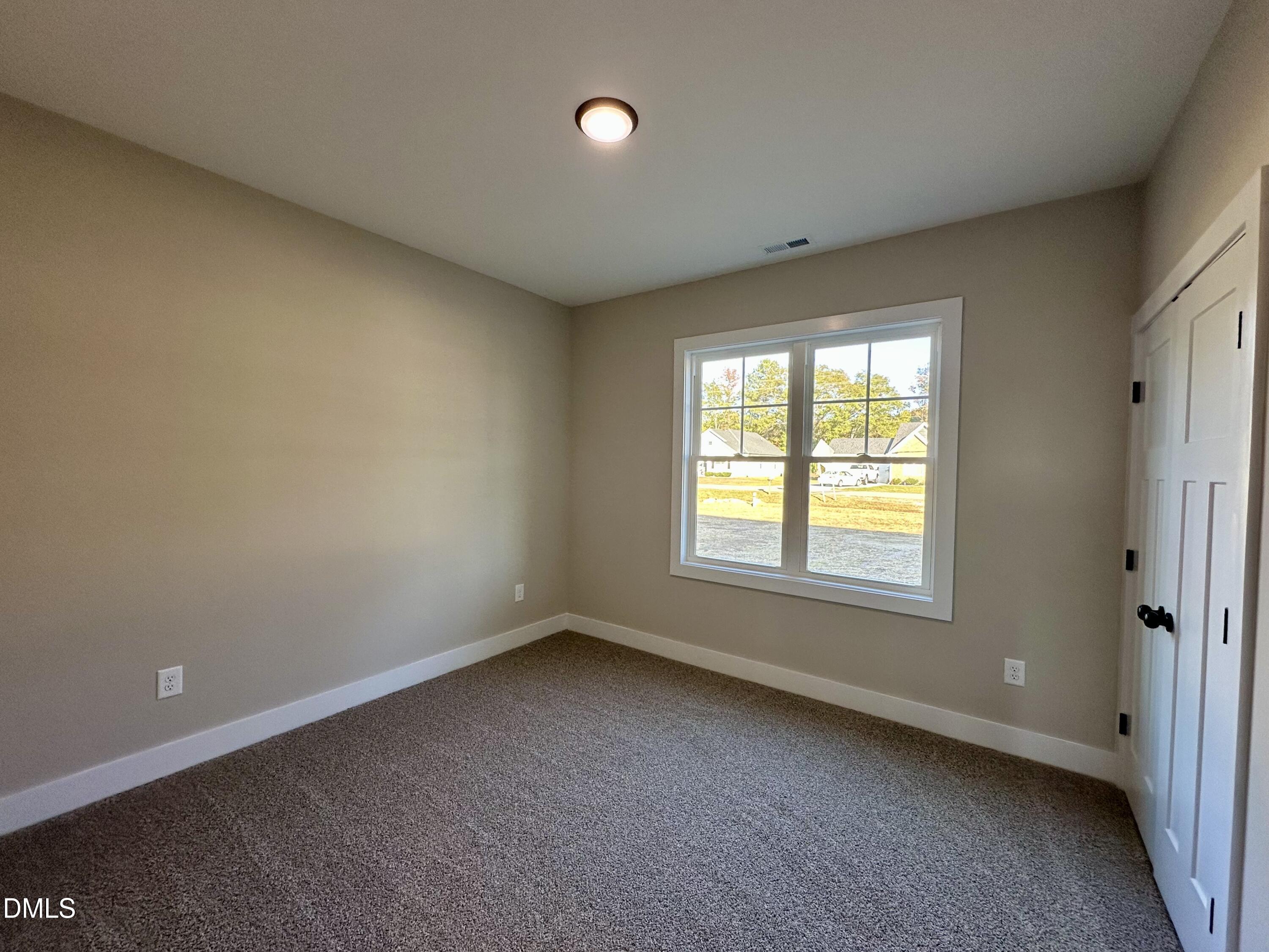 165 Bay Valley Road Kenly, NC 27542 - Photo 15 of 23 an empty room with a window