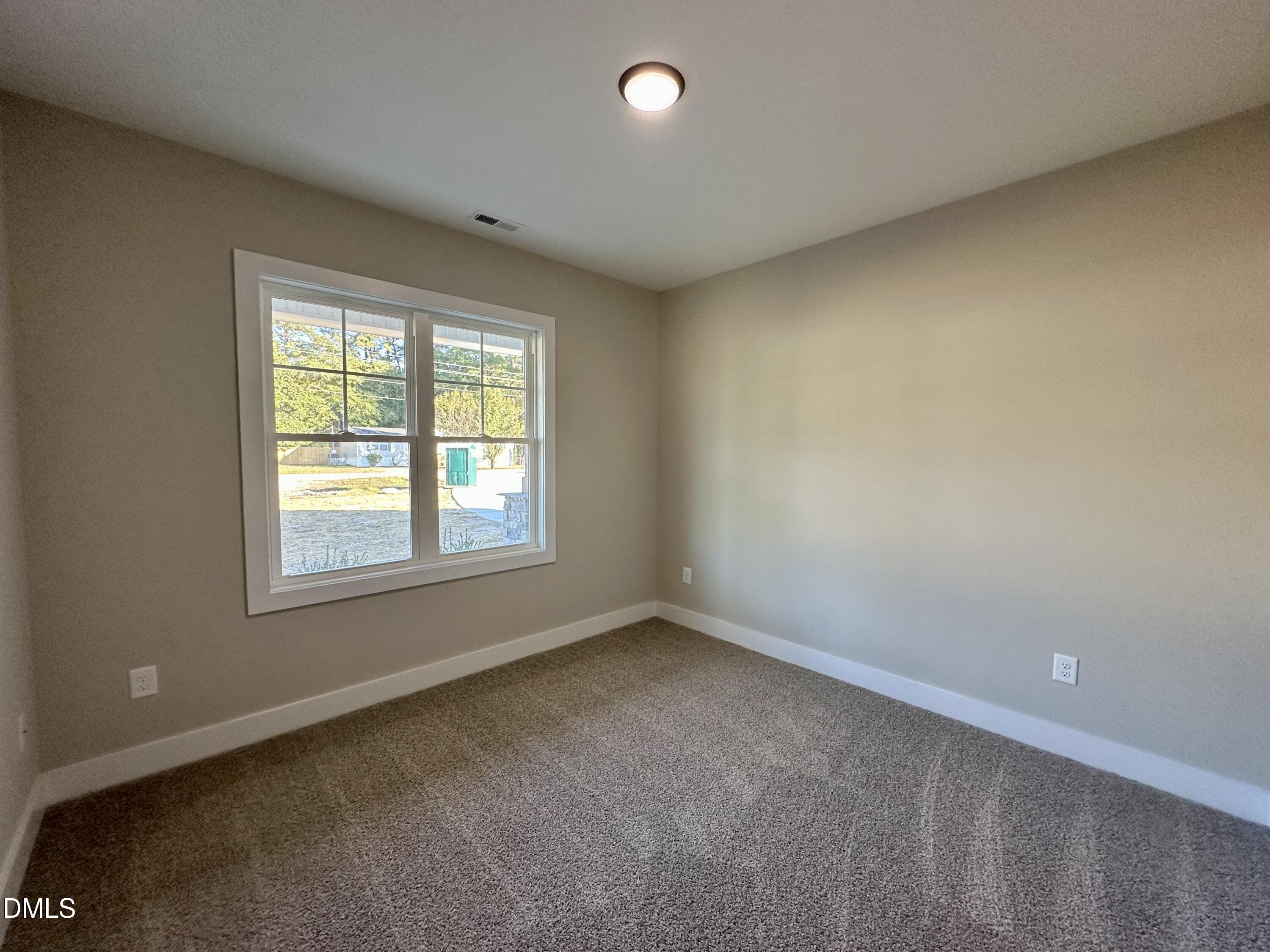 165 Bay Valley Road Kenly, NC 27542 - Photo 18 of 23 an empty room with a window