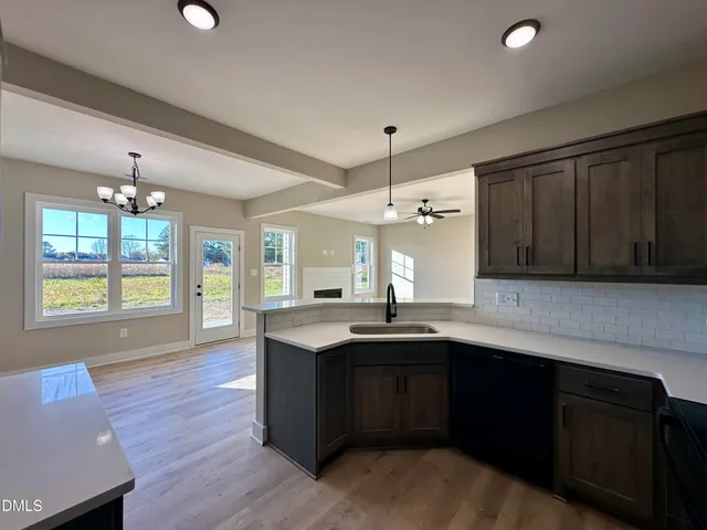 a kitchen with a sink and wooden cabinets