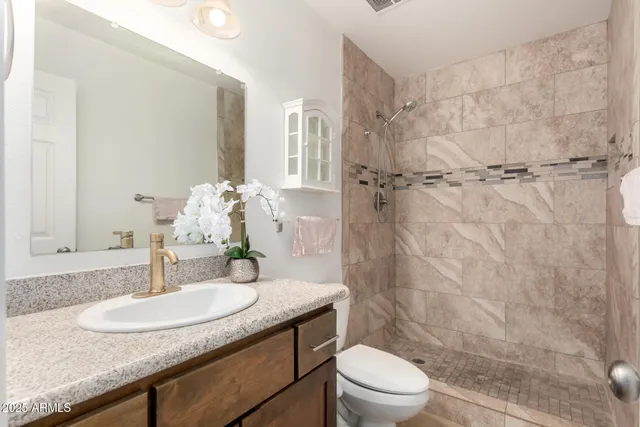 a bathroom with a granite shower