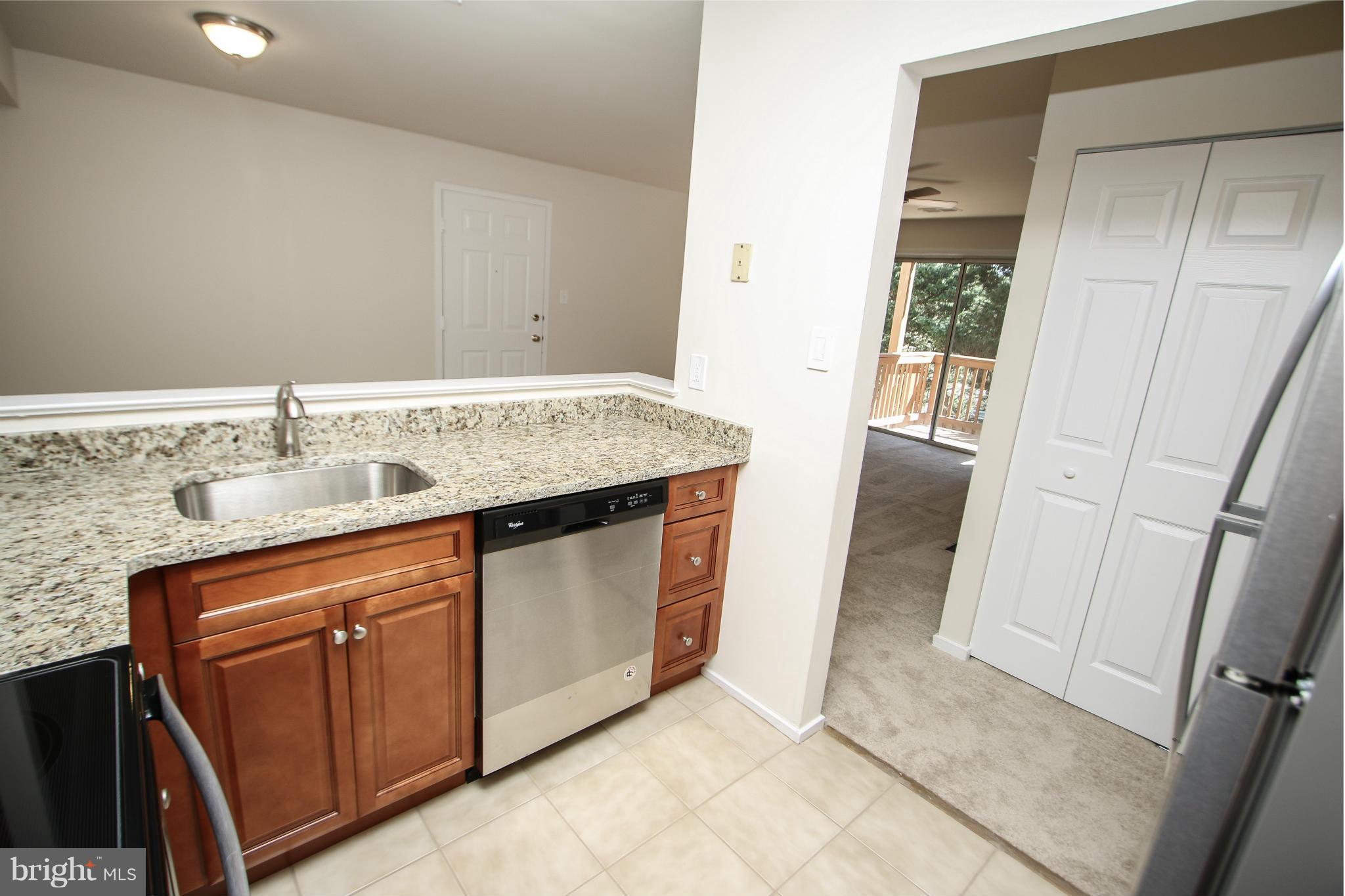 7709 Lexton Place, Unit 47 Springfield, VA 22152 - Photo 7 of 30 Kitchen with NEW Stainless Steel Appliances!