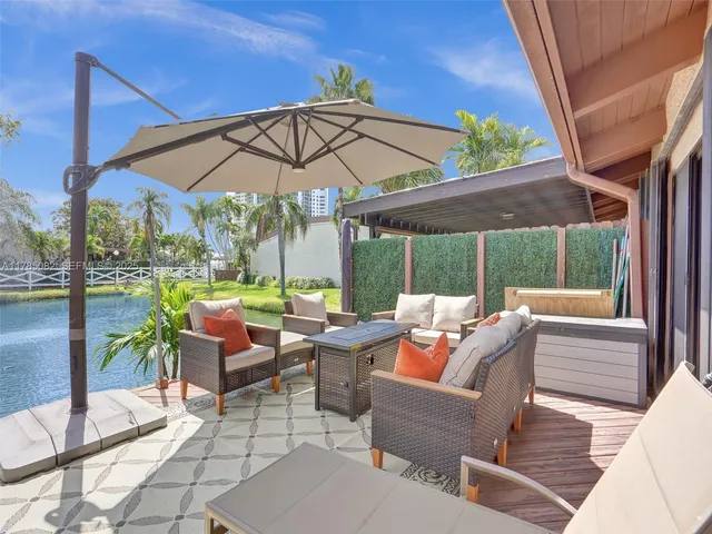 a view of a patio with table and chairs