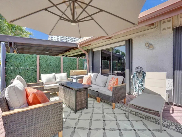 a outdoor space with patio the couches and a umbrella